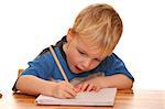 Portrait of a young boy writing isolated on white background