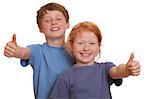 Two happy young kids with thumbs up