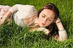 beautiful girl lying on grass