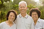 Three Senior Asian Smiling happily at park in a morning.