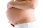Pregnant woman holding exposed belly