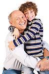 Grandfather and grandson cuddling over the white background.