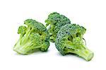 Arrangement of three fresh ripe raw broccoli pieces closeup isolated on white background