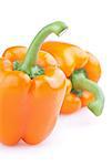 Two orange peppers isolated on white