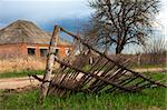 abandoned old house and broken wooden fence