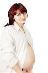 Beautiful pregnant woman in the white shirt