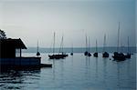 An image of some boats in the early morning mood