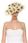 beautiful woman in hat of daisies and white dress isolated on white