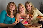 Teenage Girls Eating Pizza