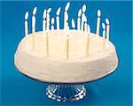 Birthday cake with burning candles on blue background