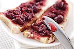 Breakfast of cherry jam on toast