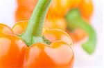 Closeup of two orange peppers