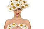 Sexy woman is covered daisies isolated on white