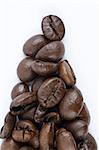 Coffee beans forming triangle on white background