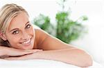 Close up of a blonde woman lying on a lounger in a wellness center