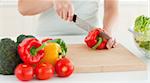 Woman cutting vegetables in the kitchen