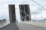 cars waiting by a drawbridge