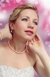 Beautiful romantic woman in the pearl necklace