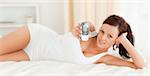 Woman showing her mobile in her bedroom