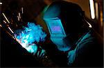 Close-up photo of welding process with sparks flying around