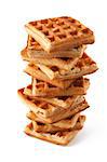 Big pile of fresh Belgian waffles on a white background