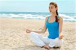 Beautiful woman practice yoga on the beach