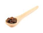 wooden spoon with coffee beans isolated on white background