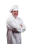 Portrait of a happy chef in a chef's hat and uniform isolated on a white background.