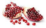 Part of pomegranate and seeds isolated on white background