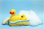 A group of rubber duckies and other bathing items come together to conceptualize a juveniles bath time.