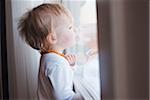 Portrait of Baby Girl Looking out Window