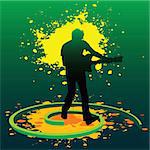 silhouette of a guitarist playing guitar in splashed paints