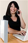 a woman enjoys the freedom of wireless networking and phone calls