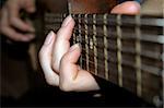 Female hands are palayng a classical guitar
