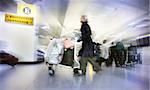 Women with bags at the airport, motion blur