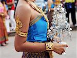 Close-up of a Thai female in bright traditional dress