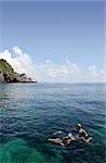 Two young people snorkelling in Ang Thong Marine Park in Thailand.