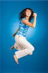 jumping happy woman on the blue background