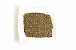 dried thyme in square white bowl isolated