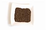 black cumin seeds in square white bowl isolated