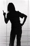 isolated on white silhouette of woman threatens by finger