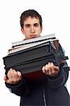 Busy handsome teenager carrying stacked files over a white background