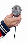 Hand holding a microphone over a white background. Mic on focus