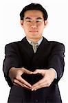 Asian young guy with love shape gesture.