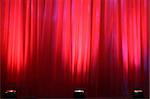 Spot lights on red curtain