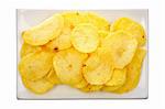 Potato chips on a plate isolated on white background. Path included