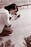 Girl shooting SLR photo camera