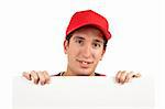 Curious teen with a red cap behind white placard