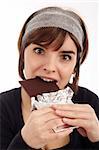 Stock Photography of pretty young woman eating chocolate