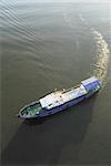 Blue and white boat in sunshine